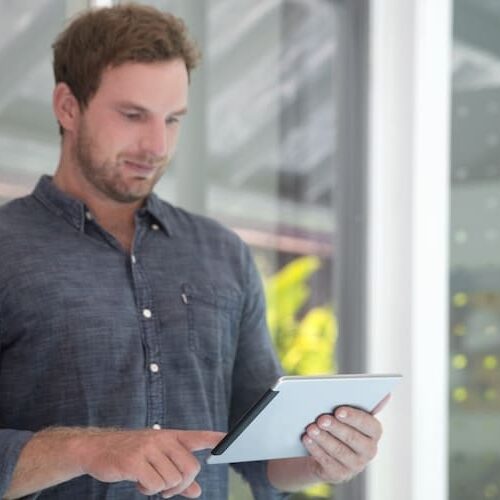 businessman checking digital tablet